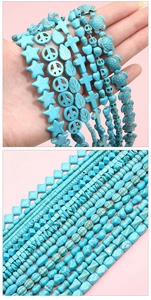 Detailed macro of turquoise blue DIY beads in assorted shapes like star leaf and cross