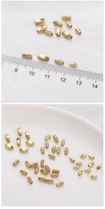Macro detail of 14K gold-filled spacer beads in smooth and textured finishes for DIY jewelry