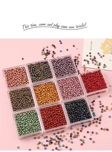 Macro shot of 2mm colorful glass seed beads set in acrylic boxes for DIY jewelry making