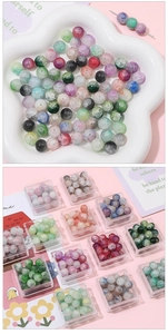 Close-up of 10mm multi-colored crackle glass beads for DIY jewelry making and bracelets