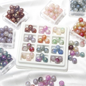 Bunte 10mm irisierende Aurora-Glasperlen für DIY-Schmuckherstellung in weißer Schale