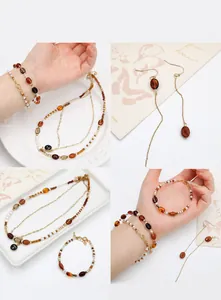 Detailed view of acrylic coffee bean beads and gold layered necklace accessories