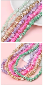 Detailed view of colorful irregular shell fragments for DIY jewelry making and crafting