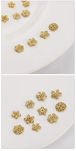 Macro shot of 14K gold plated flower and snowflake spacer beads with cubic zirconia