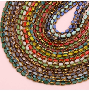 Macro shot of oval crystal beads with gold metal edges for DIY jewelry making