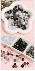 Macro view of assorted 8/10/12mm resin cat eye beads for DIY jewelry making