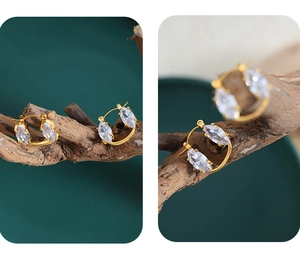 Macro detail of marquise-cut crystal earrings with 18K gold-plated stainless steel hoops