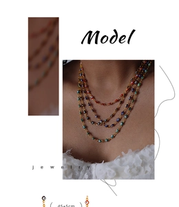 Detail of colorful Evil Eye beads on 45+5cm gold chain necklace in Bohemian style