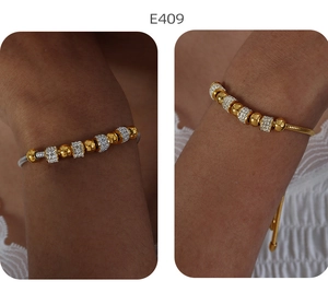 Bicolor Perlenarmband mit goldenen Kugeln und silbernen Zylindern mit Pavé-Besatz