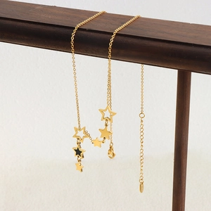 Baroque multi-star gold pendant necklace with black enamel star on a delicate chain