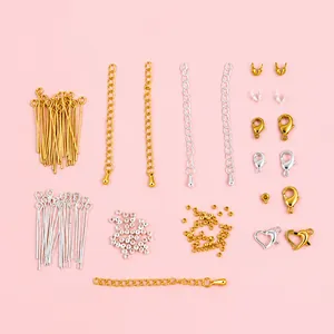 Detailed flat lay of 14k gold-plated lobster clasps and extension chains for DIY jewelry