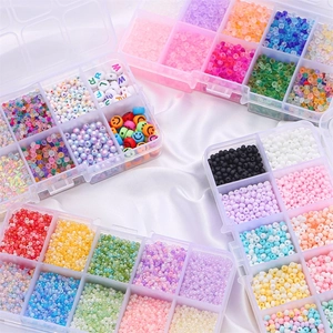 DIY bead kit with alphabet and colorful seed beads in organized storage boxes