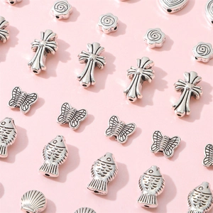 Dijes de aleación de plata antigua con mariposas y cruces para crear joyas personalizadas
