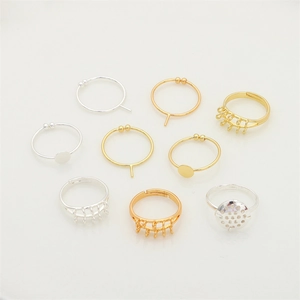 Macro shot of 18K gold and silver DIY ring bases in various grid-style mounting designs