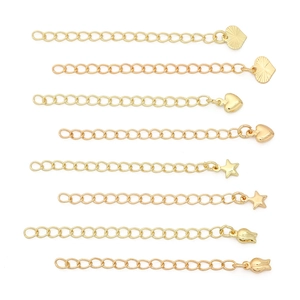 Detailed view of 14K gold plated necklace extension chains with various charms