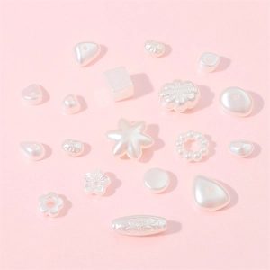 Lustrous pearl white ABS beads in assorted flower and star shapes for DIY jewelry
