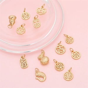 Golden Chinese lucky charms for DIY jewelry including koi fish, gourd and blessing symbols