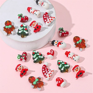 Handmade Christmas glass beads featuring snowman and Santa Claus for DIY jewelry making