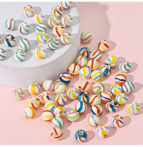 Macro detail of colorful spiral stripe ceramic beads for DIY necklace jewelry making