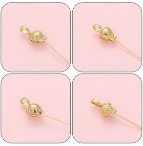 Detail of 14K gold plated DIY jewelry clasps in shell, heart and flower shapes