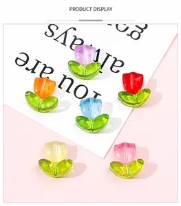 Detailed macro view of colorful gradient tulip beads for DIY jewelry making accessories