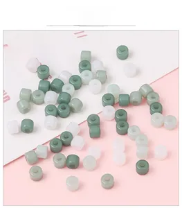 Macro detail of assorted acrylic cylinder tube beads for handmade jewelry DIY projects