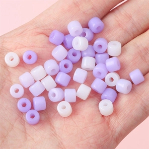 Assorted purple and white acrylic cylinder spacer beads for DIY jewelry making and crafts