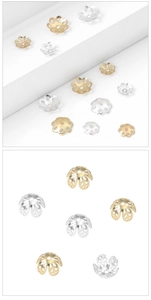 Detailed view of hollow six-petal gold and silver flower bead caps for DIY jewelry
