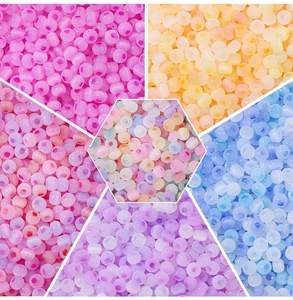 Detail of 4mm colorful cat-eye glass beads in multiple translucent shades for DIY crafts