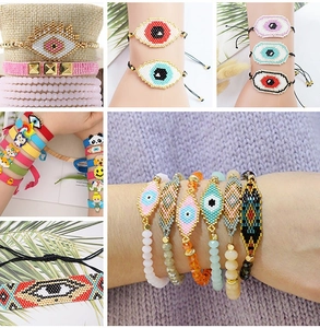 Detailed view of woven bead bracelets featuring evil eye motifs and boho patterns