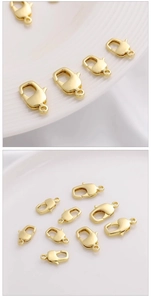 Detailed macro view of multiple 14K gold-plated lobster clasps in various sizes for DIY jewelry