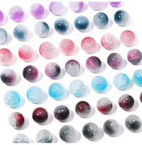 Macro detail of 10mm multi-color crackle glass beads with gradient textures for DIY jewelry