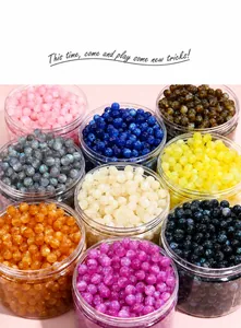 Macro view of assorted galaxy resin beads in nine colors for DIY jewelry making