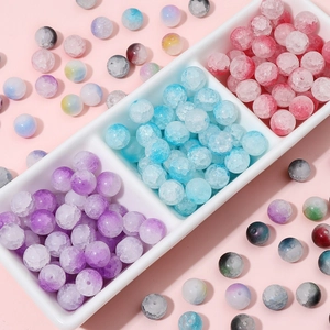 Colorful 10mm cracked glass beads for DIY jewelry making in a white ceramic tray