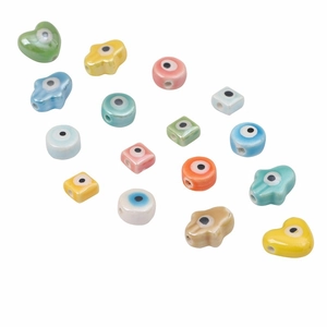 Colorful ceramic evil eye beads in heart and Hamsa shapes for DIY jewelry making