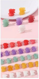 Macro detail of colorful resin bunny charms for DIY jewelry making and handmade crafts