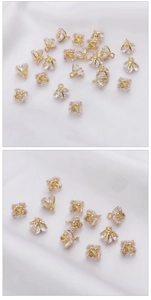 Macro detail of 14K gold plated rose flower charms with sparkling zircon stones for jewelry making