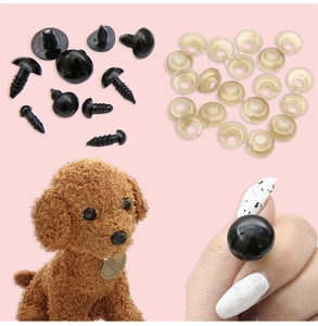 Macro detail of black plastic safety eyes and washers for DIY handmade plush toys