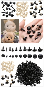 Detail view of various black acrylic safety eyes and washers for plush DIY doll making