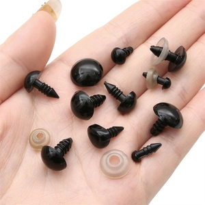 Black plastic safety eyes with washers for DIY plush animal dolls held in hand
