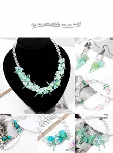 Detailed view of translucent gradient glass lily of the valley floral jewelry set