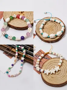 Detailed macro view of white turquoise beads, skull and star charms for DIY jewelry making