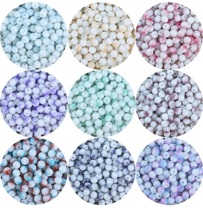 Detailed grid of 8mm porcelain white glass beads with marbled textures for DIY jewelry making