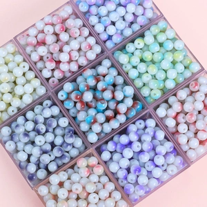 8mm porcelain white glass beads set in colorful ink-splatter patterns within grid box
