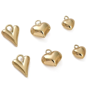 Various 14K gold plated heart charms for DIY jewelry making on white background
