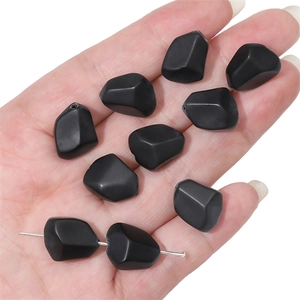 Macro shot of 12x15mm matte black faceted glass beads for DIY bracelet jewelry making