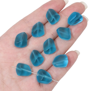Detailed view of matte blue faceted glass beads for DIY jewelry and bracelet making
