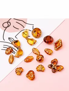 Détails de perles en acrylique ambré avec bords dorés pour la création de bijoux