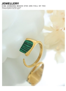 Detailed shot of a gold adjustable ring featuring a rectangular green striped malachite stone