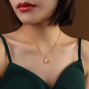 18k gold plated titanium necklace featuring white shell rose pendant with zircon accent